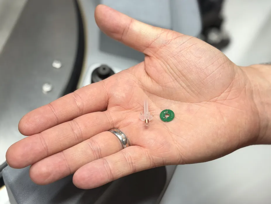 A hand holds intelligent medical consumables such as connectors and tubes developed for connected infusion therapies in the SmartInfusions research project.